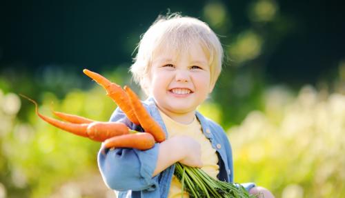 child with carrots